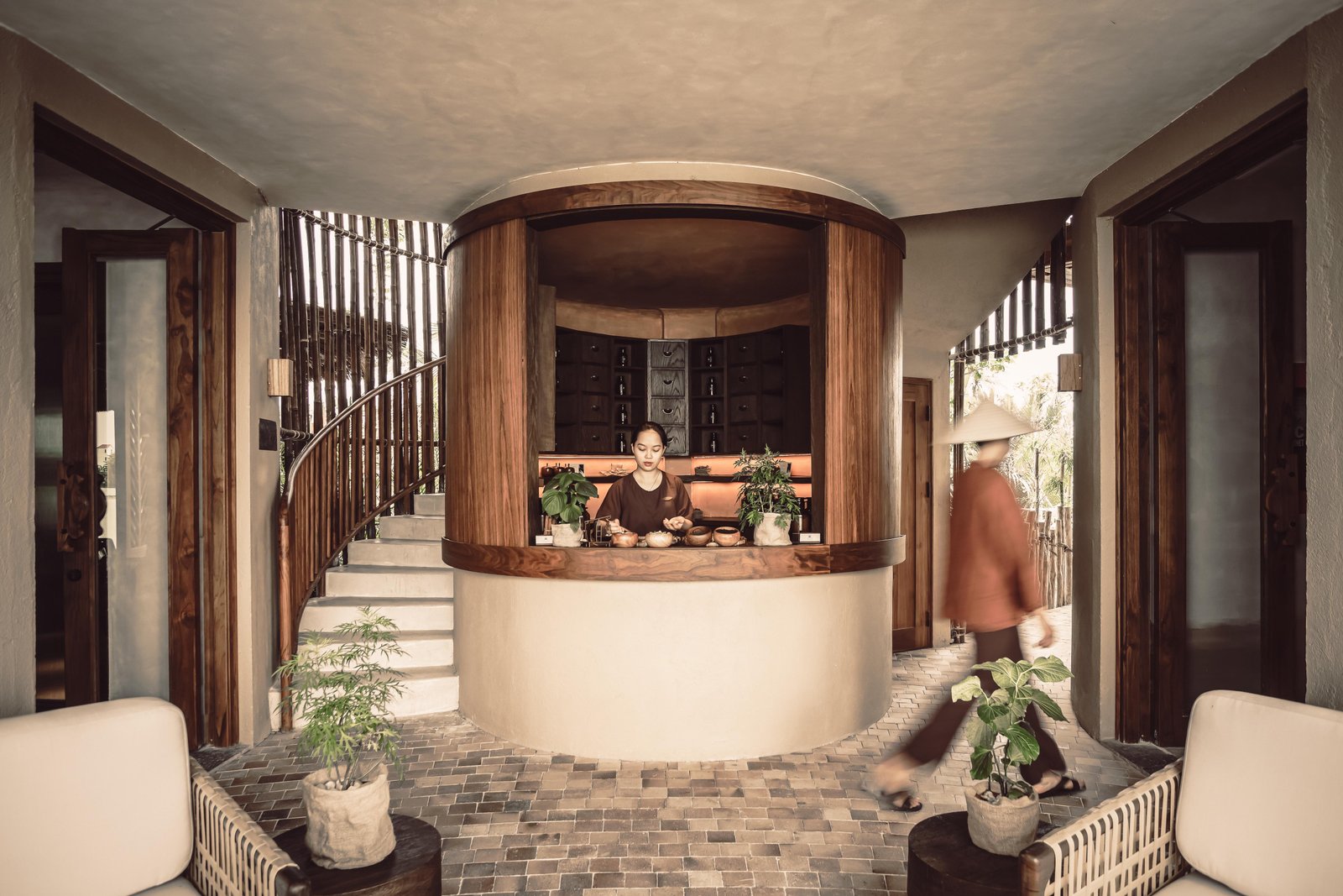 A traditional spa apothecary with rows of glass jars holding dried herbs and spices
